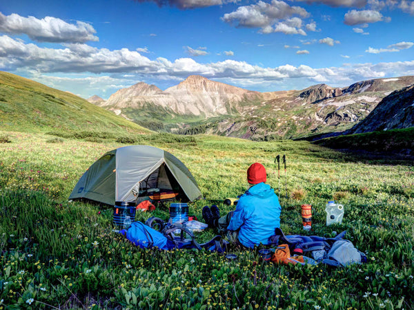 Man camping in the mountains