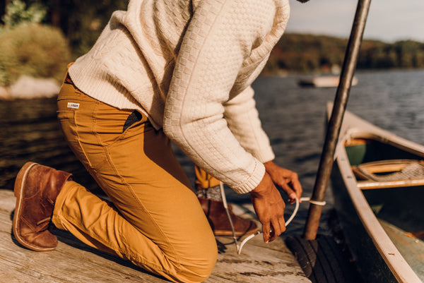 Man in pants working on boat